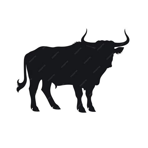 Premium Photo | Silhouette of a bull with horns standing in a field ...