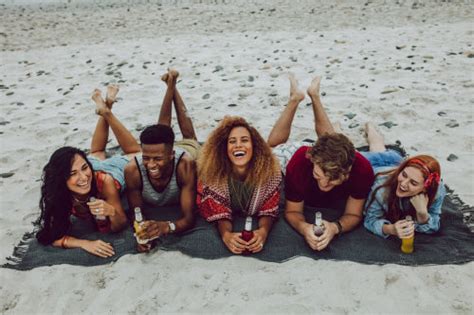 Friends Having Beers At The Sea Shore Jacob Lund Photography Store