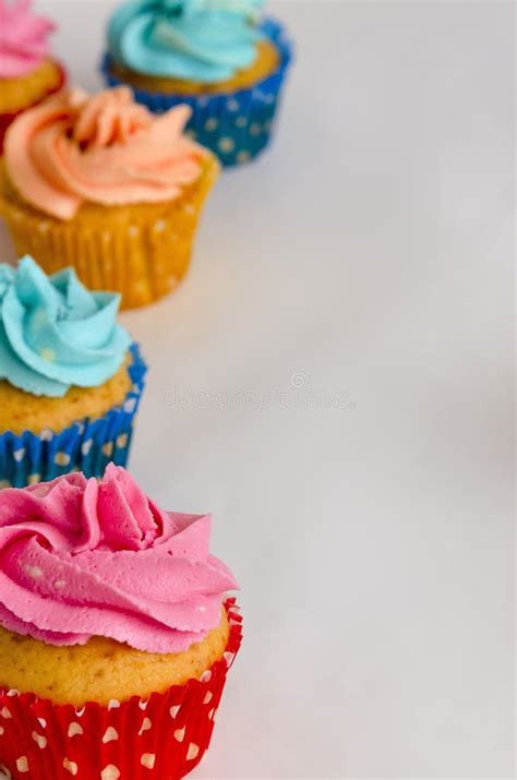 The Colorful Homemade Cupcakes On A White Background Stock Photo