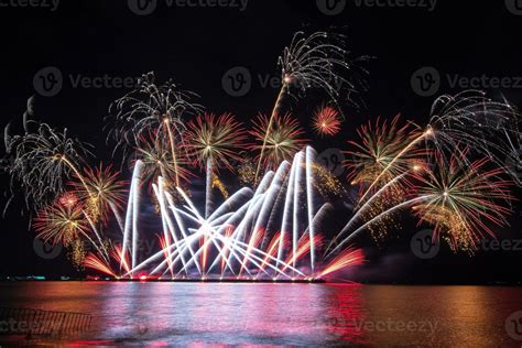 Amazing Beautiful Colorful Fireworks Display On Celebration Night Showing On The Sea Beach With