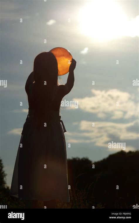 Beautiful silhouette of a little girl at sunset Stock Photo - Alamy