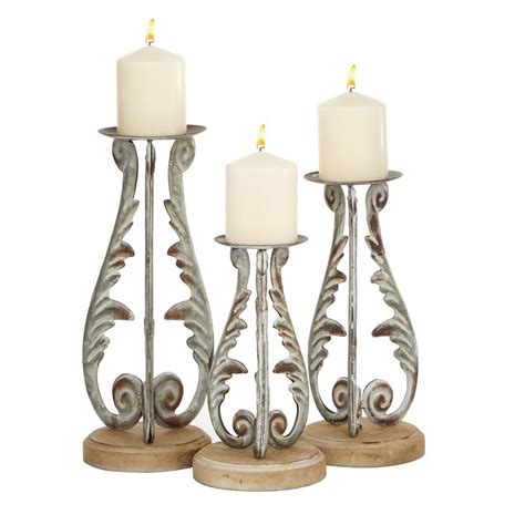 This Set Of 2 Tall Mediterranean Brown And White Metal Candle Holders