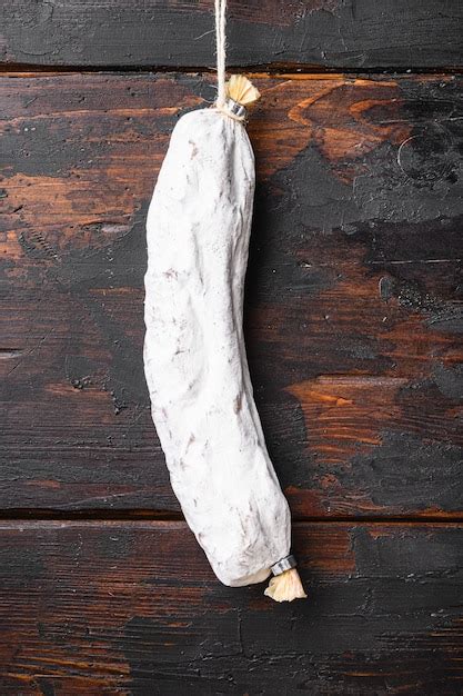 Premium Photo Dry Cured Salchichon Spanish Wurst On Wooden