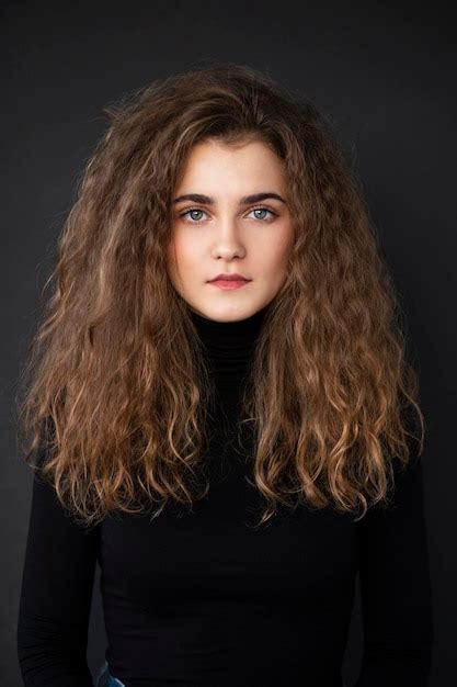 Premium Photo Close Up Front Portrait Of A Young Woman With Curly