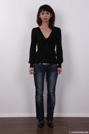 Skinny Brunette In Black Blouse Blue Jeans White Belt XXX Dessert