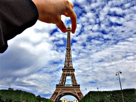 Pictures Of People Holding The Eiffel Tower Business Insider