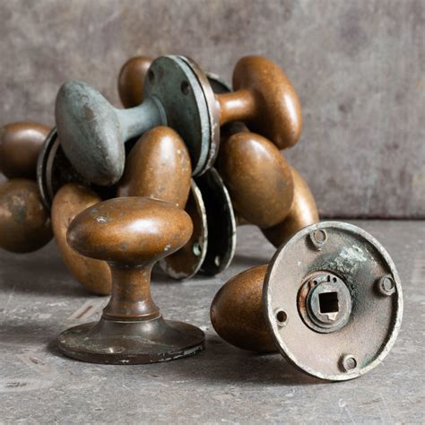 Early Twentieth Century Patinated Brass Oval Door Knobs Lassco