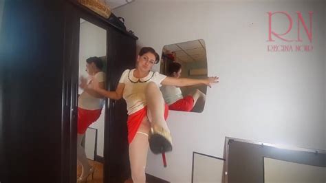 A Naked Lady Does Make Up In Front Of A Mirror Puts On Underwear Stockings A Skirt 3