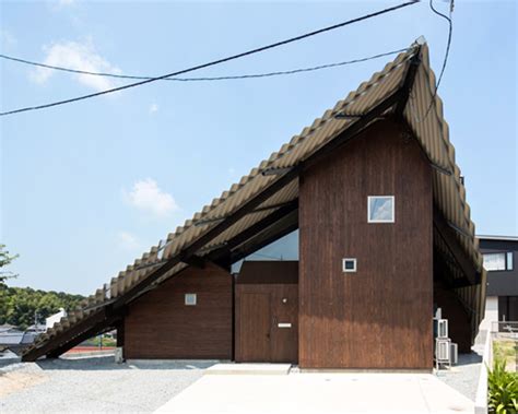 folded roof protects rain shelter house by y+M design office