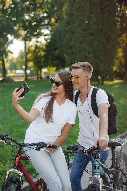 Free Photo Couple Riding Bikes In Summer Forest