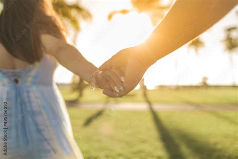 Come take my hand, couple holding hands in the park Stock Photo | Adobe ...