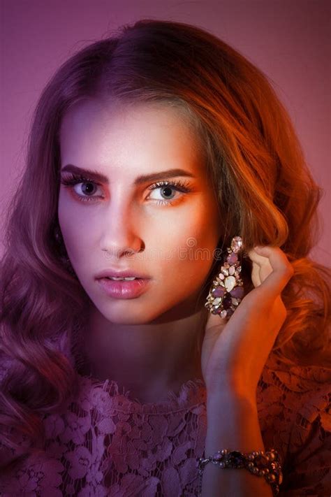 Beauty Studio Portrait Of Girl In Pink Dress With Wavy Hairstyle Stock