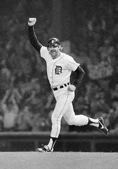 An Old Photo Of A Baseball Player Running On The Field With His Arm In