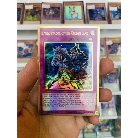 Thẻ Bài Lẻ Yugioh Mã Mged En054 Conquistador Of The Golden Land Premium Gold Rare 1st