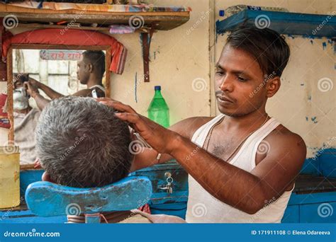 Indian Barber Shaving Man On The Street In Kolkata India Editorial