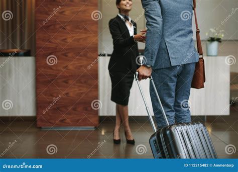 Concierge Welcoming Guest at Hotel Lobby Stock Photo - Image of welcoming, male: 112215482