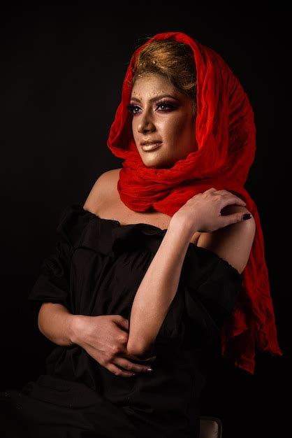 Premium Photo Portrait Of Woman Standing Against Black Background