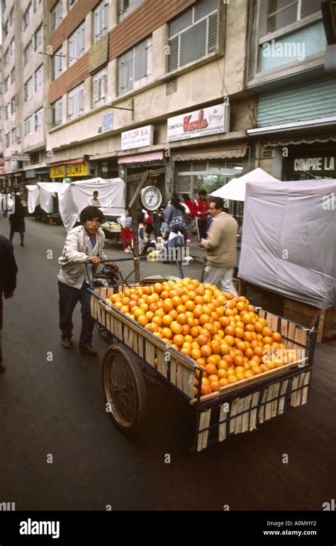 Peru Lima man with barrow of oranges Stock Photo - Alamy