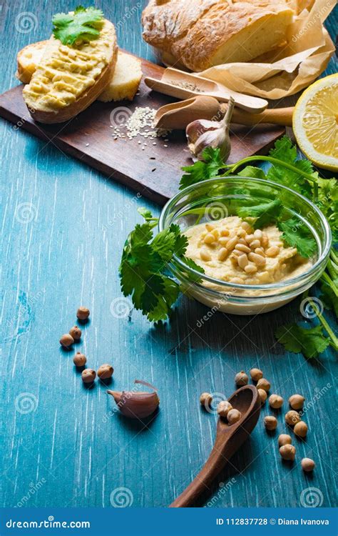 Traditional Hummus Or Houmous Appetizer Made Of Mashed Chickpeas With