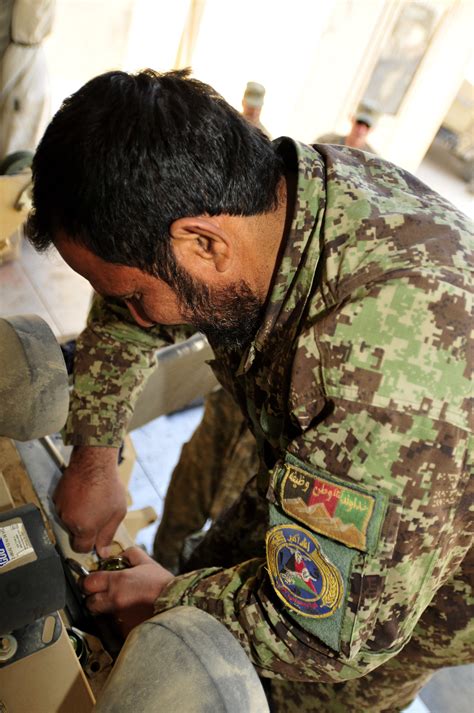 Afghan National Army Soldiers 25th Cab Turn Wrenches Together