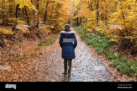 Girl walking alone in forest hi-res stock photography and images - Alamy