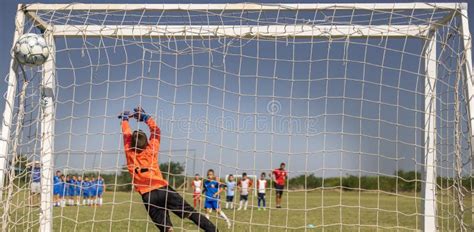 Soccer Goal with a Young Boy Goalkeeper Stock Image - Image of save ...