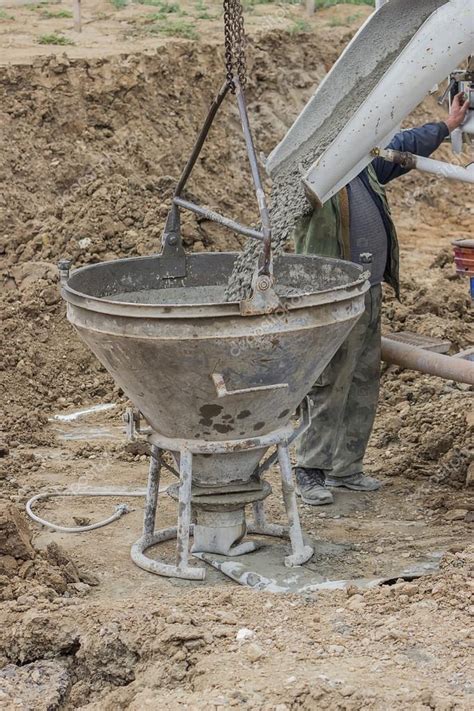 Builder Worker Filling Concrete Funnel — Stock Photo © Kataklinger