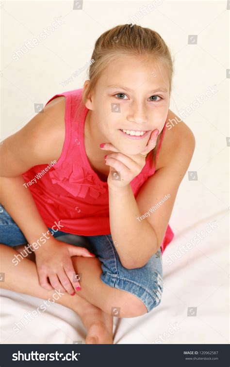Blonde Preteen Girl Isolated On White Seated On Floor Stock Photo 120962587 Shutterstock