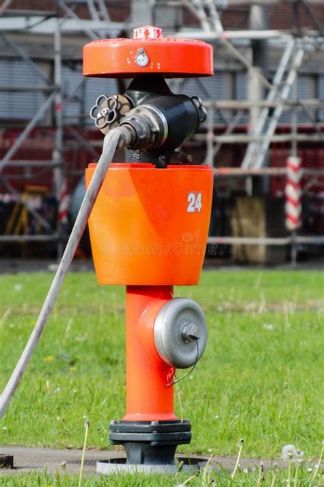 Red Fire Hydrant With Fire Hose Stock Photo Image Of Water Services