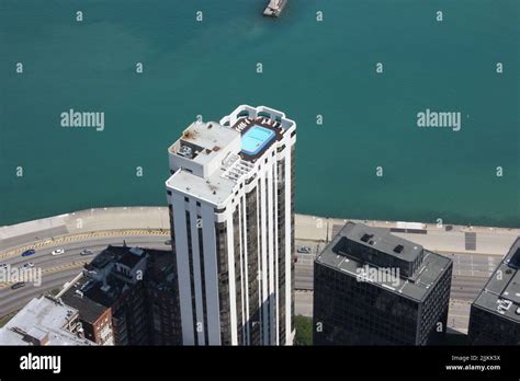 A Birds Eye View Of A Swimming Pool On Top Of A Skyscraper In Chicago