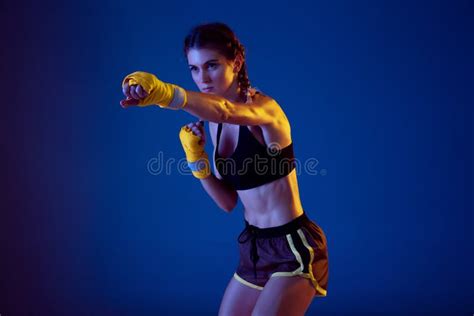 Fit Caucasian Woman in Sportswear Boxing on Blue Studio Background in ...