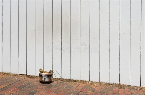 Painting a Picket Fence stock image. Image of fence - 107860123