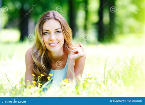 Young Woman In Blue Dress Lying On Grass Stock Image Image Of Green