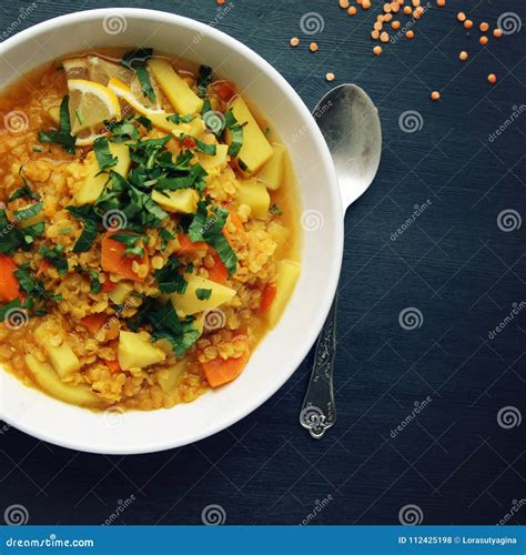 Red Lentil Stew With Potato Carrot And Turmeric Stock Photo Image