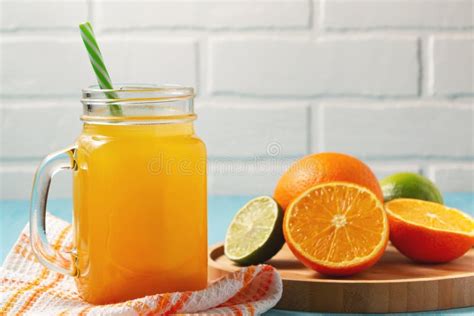 Homemade Freshly Squeezed Orange Juice In A Mason Jar Oranges And Lime