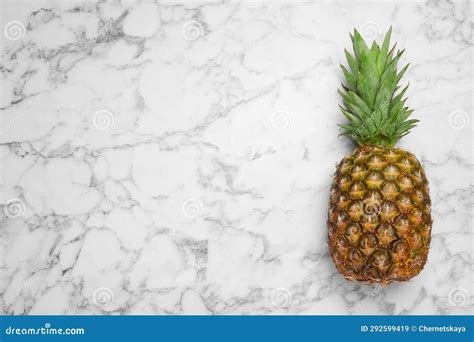 Whole Ripe Pineapple On White Marble Table Top View Space For Text