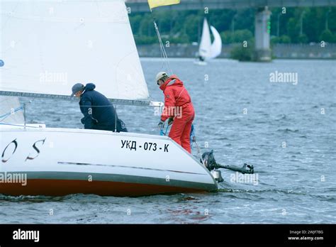 Crew of sailing yacht yachtsmen conducting a flanking maneuver. Amateur regatta Stock Photo - Alamy