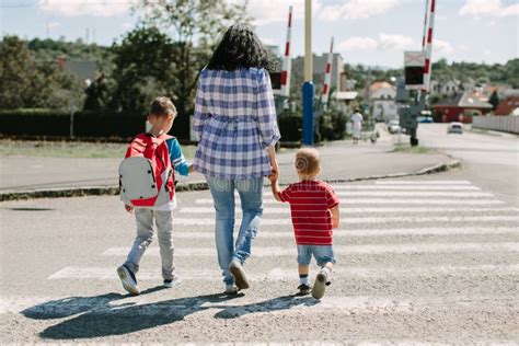 Mother And Child Crossing The Road Stock Image Image Of City Cross