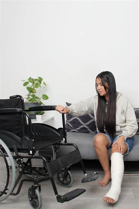 Year Old Latina Woman With Her Leg In A Cast That Accidentally Broke Uses A Wheelchair For