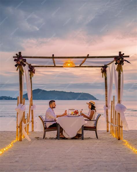 Premium Photo Couple Having A Romantic Dinner On The Beach Of Phuket