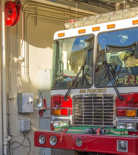 SFFD Red Firetruck And Ambulance Van Parked At Fire Station Editorial