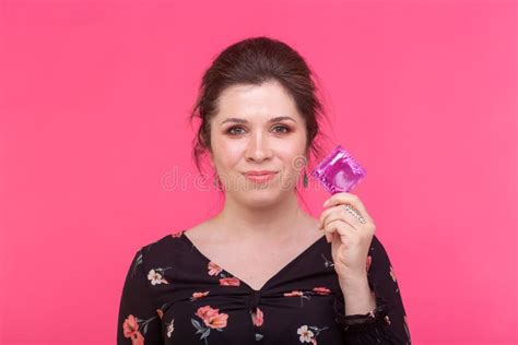 Safe Sex Health And Contraception Concept Woman Holding In Hands A