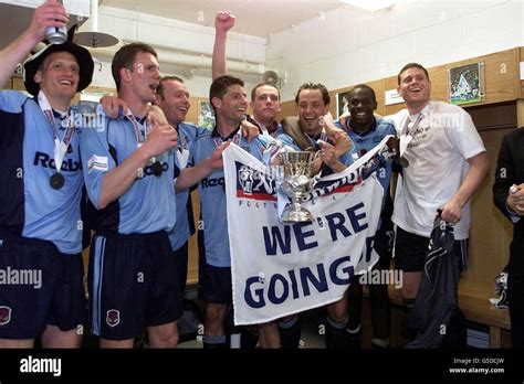 Bolton Players Celebrate In The Dressing Room After Winning The