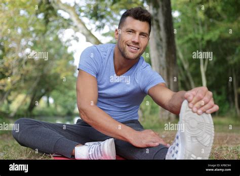 Man Stretching Leg As Warm Up Before Run Stock Photo Alamy