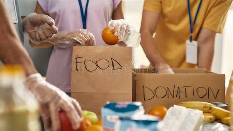 Hands Of Volunteers Serves Free Food To The Poor And Needy In The City