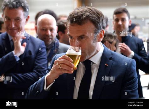 French President Emmanuel Macron Drinks A Beer During A Visit To Mathis