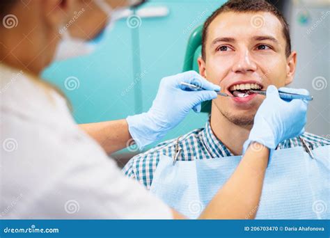 Patient With Open Mouth In Dental Clinic Preparation For Dental