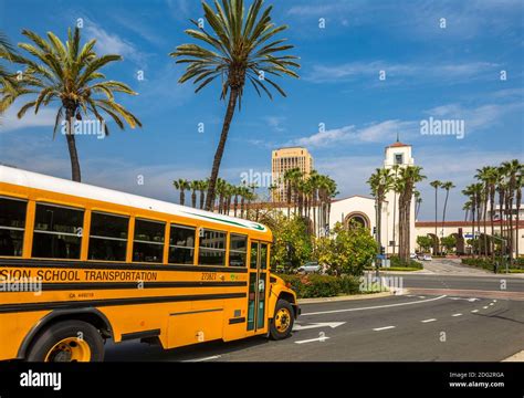 Tradition yellow school bus approaching Union Station, Old Plaza, Los ...