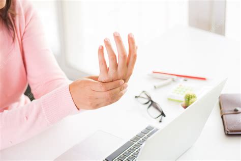 Premium Photo | Woman holding her wrist pain from using computer ...