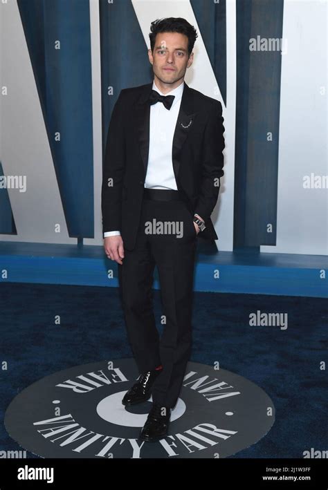 Rami Malek walking on the red carpet at the 2022 Vanity Fair Oscar ...